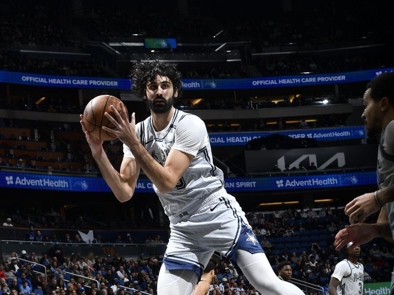 ORLANDO, FL - JANUARY 9: Goga Bitadze #35 of the Orlando Magic rebounds the ball during the game against the Minnesota Timberwolves on January 9, 2025 at Kia Center in Orlando, Florida. NOTE TO USER: User expressly acknowledges and agrees that, by downloading and or using this photograph, User is consenting to the terms and conditions of the Getty Images License Agreement. Mandatory Copyright Notice: Copyright 2025 NBAE (Photo by Fernando Medina/NBAE via Getty Images)