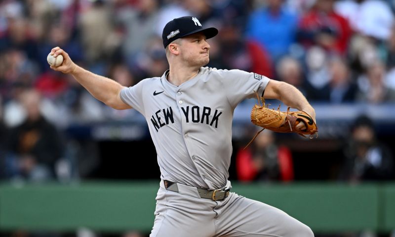 Oct 17, 2024; Cleveland, Ohio, USA; New York Yankees pitcher Clarke Schmidt (36) throws during the first inning against the Cleveland Guardians in game 3 of the American League Championship Series at Progressive Field. Mandatory Credit: Ken Blaze-Imagn Images