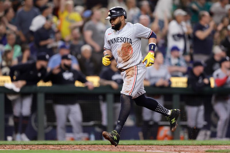 Jun 29, 2024; Seattle, Washington, USA; Minnesota Twins first baseman Carlos Santana (30) scores against the Seattle Mariners during the fourth inning at T-Mobile Park. Mandatory Credit: John Froschauer-USA TODAY Sports