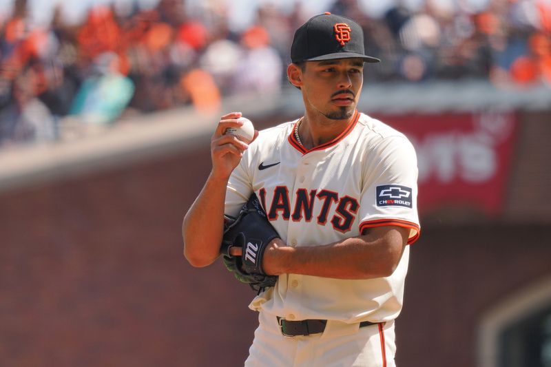 Apr 5, 2024; San Francisco, California, USA; San Francisco Giants starting pitcher Jordan Hicks (12) prepares to pitch the ball against the San Diego Padres during the first inning at Oracle Park. Mandatory Credit: Kelley L Cox-USA TODAY Sports