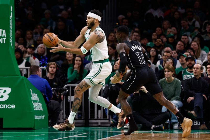 BOSTON, MA - FEBRUARY 14: Dennis Schroder #17 of the Brooklyn Nets chases down Jayson Tatum #0 of the Boston Celtics holding onto one of his shoes during the second half at TD Garden on February 14, 2024 in Boston, Massachusetts. NOTE TO USER: User expressly acknowledges and agrees that, by downloading and/or using this Photograph, user is consenting to the terms and conditions of the Getty Images License Agreement. (Photo By Winslow Townson/Getty Images)