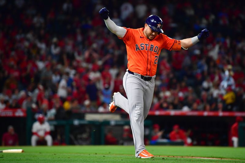 Jun 7, 2024; Anaheim, California, USA; Houston Astros designated hitter Yainer Diaz (21) reacts after hitting a two run home run against the Los Angeles Angels during the seventh inning at Angel Stadium. Mandatory Credit: Gary A. Vasquez-USA TODAY Sports