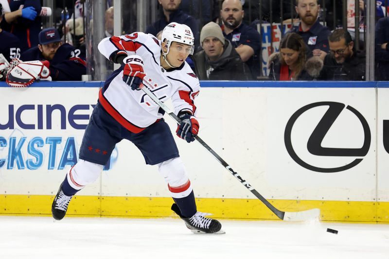 Jan 14, 2024; New York, New York, USA; Washington Capitals defenseman Martin Fehervary (42) plays the puck against the New York Rangers during the first period at Madison Square Garden. Mandatory Credit: Brad Penner-USA TODAY Sports