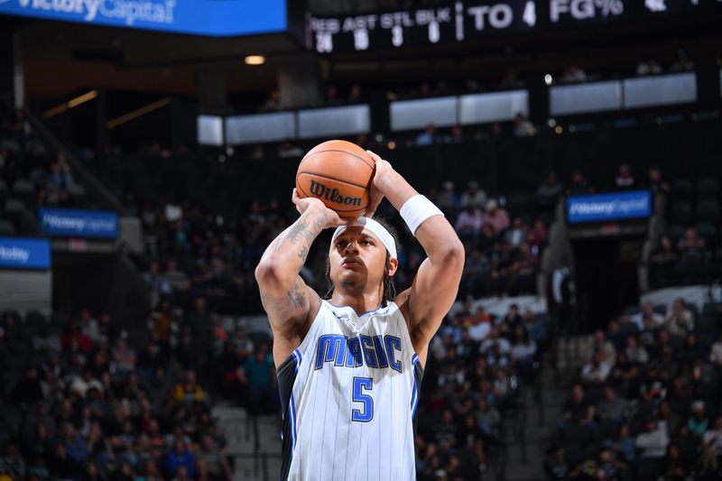 SAN ANTONIO, TX - JANUARY 31: Paolo Banchero #5 of the Orlando Magic shoots a free throw during the game against the San Antonio Spurs on January 31, 2024 at the Frost Bank Center in San Antonio, Texas. NOTE TO USER: User expressly acknowledges and agrees that, by downloading and or using this photograph, user is consenting to the terms and conditions of the Getty Images License Agreement. Mandatory Copyright Notice: Copyright 2024 NBAE (Photos by Michael Gonzales/NBAE via Getty Images)