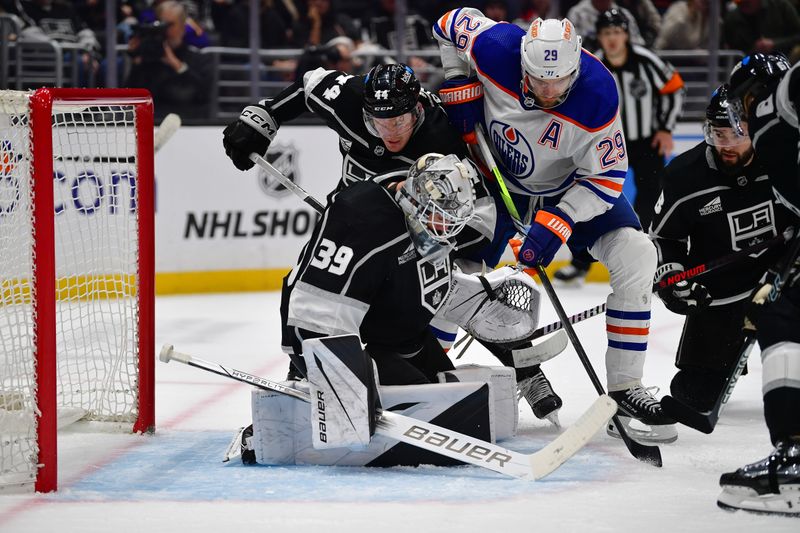 Dec 30, 2023; Los Angeles, California, USA; Los Angeles Kings defenseman Mikey Anderson (44) helps goaltender Cam Talbot (39) defend the goal against Edmonton Oilers center Leon Draisaitl (29) during the third period at Crypto.com Arena. Mandatory Credit: Gary A. Vasquez-USA TODAY Sports