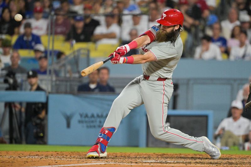 Sep 16, 2025; Los Angeles, California, USA; Philadelphia Phillies center fielder Brandon Marsh (16) hits a grand slam during the sixth inning against the Los Angeles Dodgers at Dodger Stadium. Mandatory Credit: Jayne Kamin-Oncea-Imagn Images