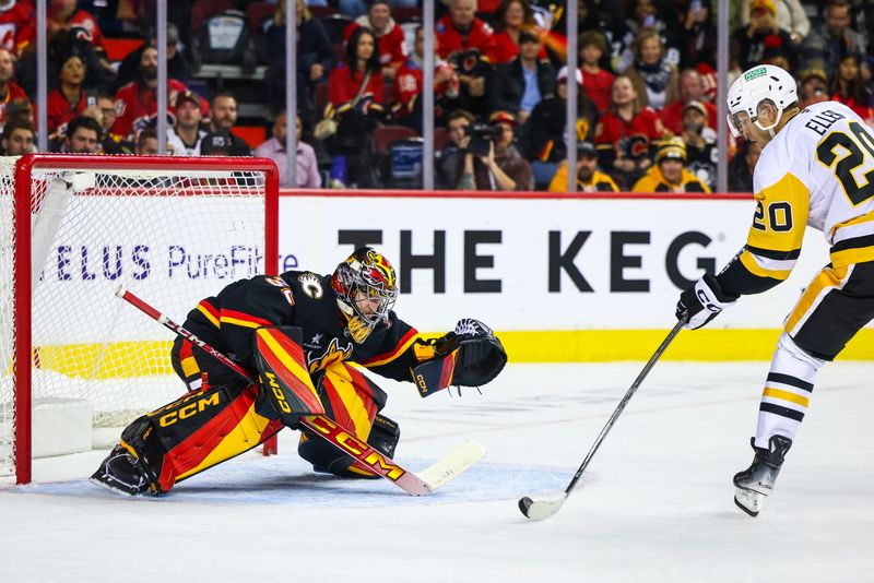 Oct 22, 2024; Calgary, Alberta, CAN; Calgary Flames goaltender Dustin Wolf (32) makes a save against Pittsburgh Penguins center Lars Eller (20) during the shootout period at Scotiabank Saddledome. Mandatory Credit: Sergei Belski-Imagn Images