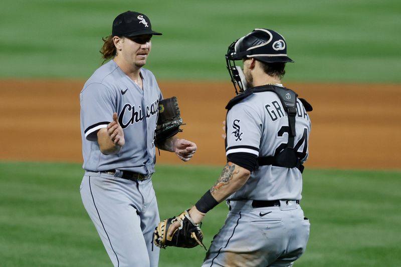 Sep 18, 2023; Washington, District of Columbia, USA; Chicago White Sox starting pitcher Mike Clevinger (52) celebrates with White Sox catcher Yasmani Grandal (24) after the final out against the Washington Nationals at Nationals Park. Mandatory Credit: Geoff Burke-USA TODAY Sports