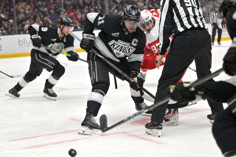 Nov 16, 2024; Los Angeles, California, USA; Los Angeles Kings center Anze Kopitar (11) beats Detroit Red Wings center Marco Kasper (92) in a face off in the third period at Crypto.com Arena. Mandatory Credit: Jayne Kamin-Oncea-Imagn Images