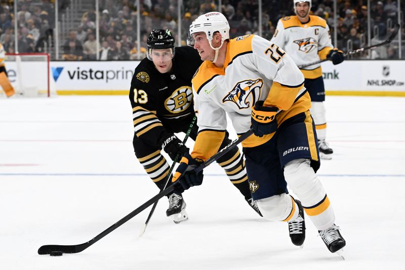 Oct 14, 2023; Boston, Massachusetts, USA; Nashville Predators defenseman Tyson Barrie (22) controls the puck in front of Boston Bruins center Charlie Coyle (13) during the third period at the TD Garden. Mandatory Credit: Brian Fluharty-USA TODAY Sports