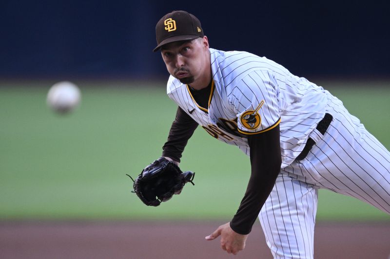 Jul 8, 2023; San Diego, California, USA; San Diego Padres starting pitcher Blake Snell (4) throws a pitch against the New York Mets during the first inning at Petco Park. Mandatory Credit: Orlando Ramirez-USA TODAY Sports