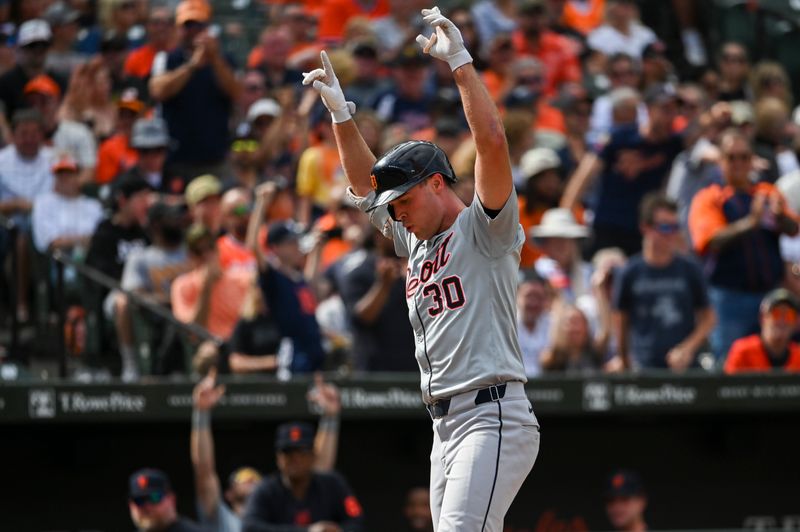 Sep 22, 2024; Baltimore, Maryland, USA;  Detroit Tigers outfielder Kerry Carpenter (30) celebrates at home plate after hitting a sixth inning solo home run against the Baltimore Orioles at Oriole Park at Camden Yards. Mandatory Credit: Tommy Gilligan-Imagn Images