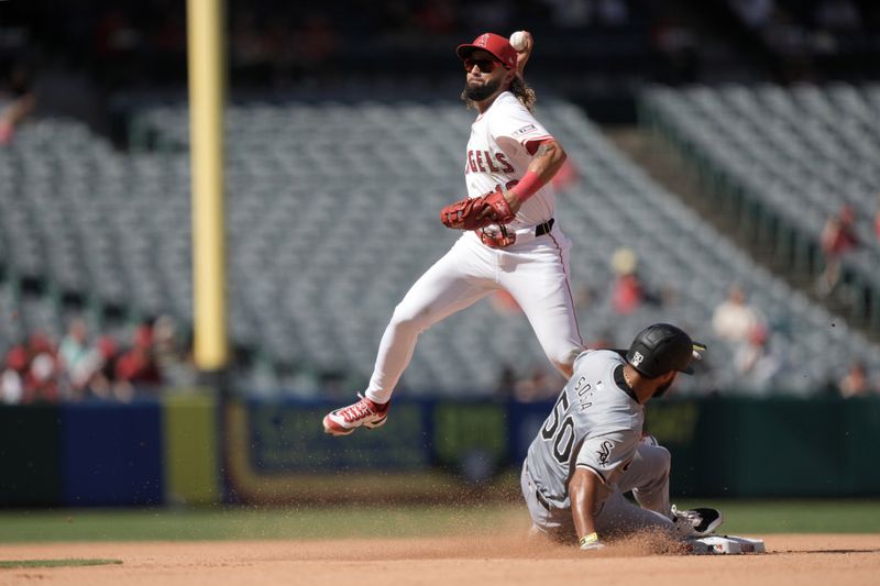 Sep 18, 2024; Anaheim, California, USA; Los Angeles Angels shortstop Jack Lopez (10) forces out Chicago White Sox second baseman Lenyn Sosa (50) out at second base in the seventh inning at Angel Stadium. Mandatory Credit: Kirby Lee-Imagn Images