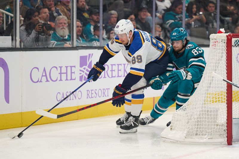 Nov 16, 2023; San Jose, California, USA; St. Louis Blues left wing Pavel Buchnevich (89) skates with the puck against San Jose Sharks defenseman Nikita Okhotiuk (83) during the first period at SAP Center at San Jose. Mandatory Credit: Robert Edwards-USA TODAY Sports