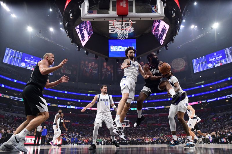 LOS ANGELES, CA - APRIL 23: James Harden #1 of the LA Clippers passes the ball during the game against the Dallas Mavericks during Round 1 Game 2 of the 2024 NBA Playoffs on April 23, 2024 at Crypto.Com Arena in Los Angeles, California. NOTE TO USER: User expressly acknowledges and agrees that, by downloading and/or using this Photograph, user is consenting to the terms and conditions of the Getty Images License Agreement. Mandatory Copyright Notice: Copyright 2024 NBAE (Photo by Adam Pantozzi/NBAE via Getty Images)