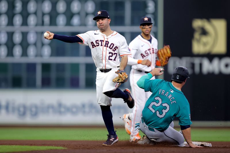 May 5, 2024; Houston, Texas, USA; Houston Astros second baseman Jose Altuve (27) throws a fielded ball to first base to complete a double play against the Seattle Mariners during the fifth inning at Minute Maid Park. Mandatory Credit: Erik Williams-USA TODAY Sports