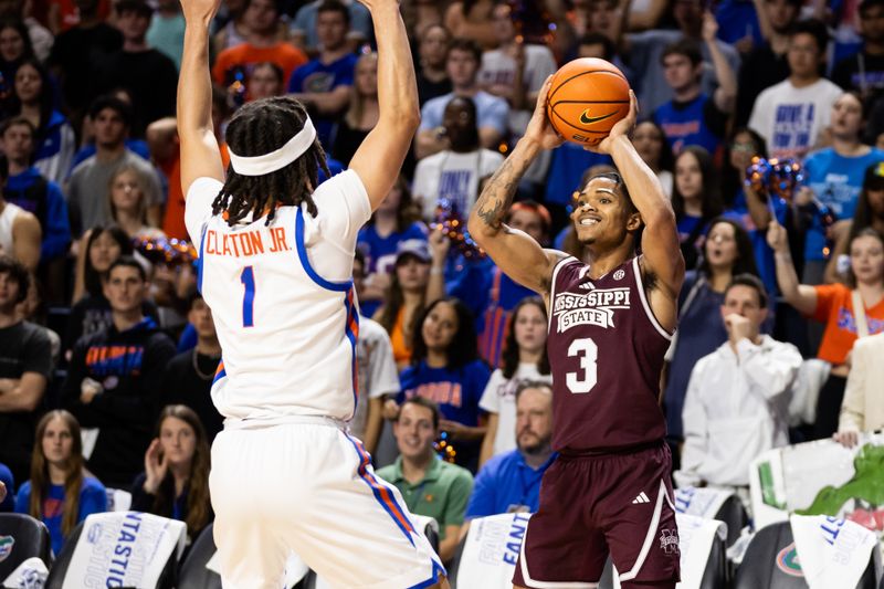 Jan 24, 2024; Gainesville, Florida, USA; Mississippi State Bulldogs guard Shakeel Moore (3) looks to pass around Florida Gators guard Walter Clayton Jr. (1) during the first half at Exactech Arena at the Stephen C. O'Connell Center. Mandatory Credit: Matt Pendleton-USA TODAY Sports