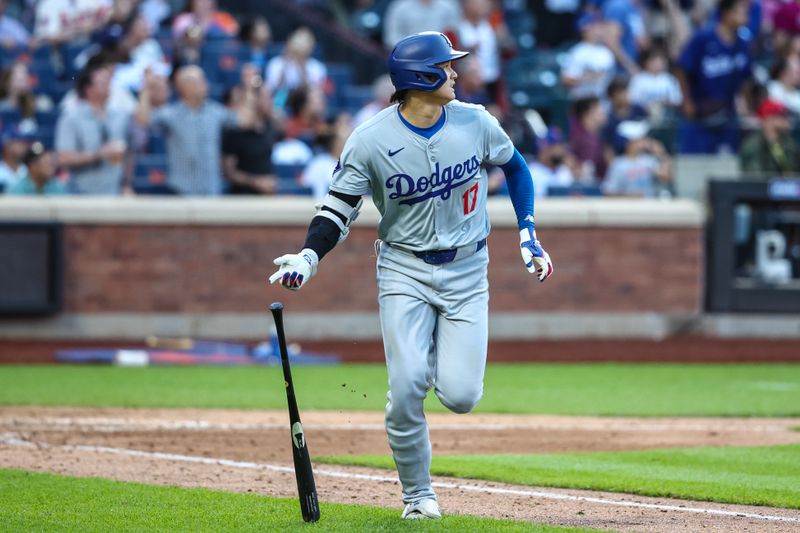 May 29, 2024; New York City, New York, USA;  Los Angeles Dodgers designated hitter Shohei Ohtani (17) hits a two rum home run in the eighth inning against the New York Mets at Citi Field. Mandatory Credit: Wendell Cruz-USA TODAY Sports