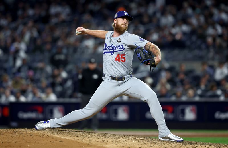 Oct 28, 2024; New York, New York, USA; Los Angeles Dodgers pitcher Michael Kopech (45) throws during the ninth inning against the New York Yankees in game three of the 2024 MLB World Series at Yankee Stadium. Mandatory Credit: Wendell Cruz-Imagn Images