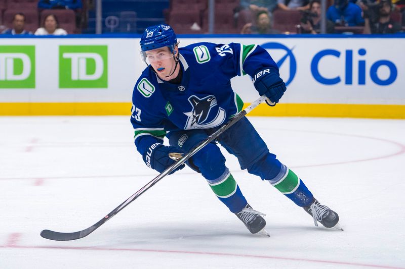 Sep 24, 2024; Vancouver, British Columbia, CAN; Vancouver Canucks forward Jonathan Lekkerimaki (23) skates against the Seattle Kraken during the third period at Rogers Arena. Mandatory Credit: Bob Frid-Imagn Images