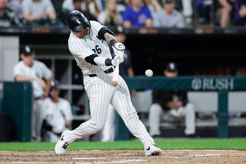 Aug 9, 2024; Chicago, Illinois, USA; Chicago White Sox catcher Korey Lee (26) singles against the Chicago Cubs during the fourth inning at Guaranteed Rate Field. Mandatory Credit: Kamil Krzaczynski-USA TODAY Sports