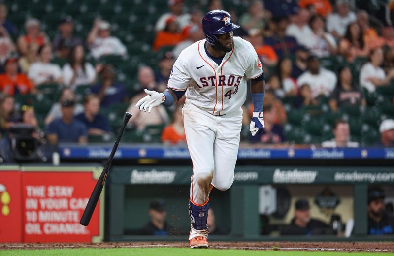 Jul 10, 2024; Houston, Texas, USA; Houston Astros designated hitter Yordan Alvarez (44) hits an RBI single during the second inning against the Miami Marlins at Minute Maid Park. Mandatory Credit: Troy Taormina-USA TODAY Sports