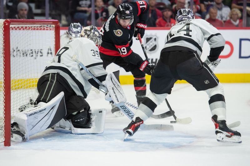 Nov 2, 2023; Ottawa, Ontario, CAN; Los Angeles Kings goalie Cam Talbot (39) makes a save on a shot from Ottawa Senators right wing Drake Batherson (19) in the first period at the Canadian Tire Centre. Mandatory Credit: Marc DesRosiers-USA TODAY Sports