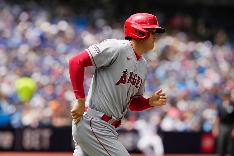 Jul 30, 2023; Toronto, Ontario, CAN; Los Angeles Angels designated hitter Shohei Ohtani (17) heads to first base after being walked by the Toronto Blue Jays during the fourth inning at Rogers Centre. Mandatory Credit: John E. Sokolowski-USA TODAY Sports