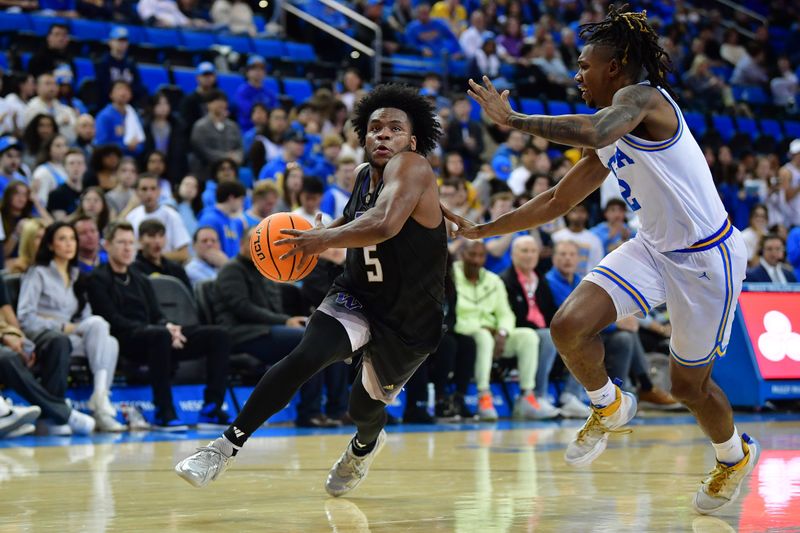 January 14, 2024; Los Angeles, California, USA; Washington Huskies guard Sahvir Wheeler (5) moves to the basket against UCLA Bruins guard Dylan Andrews (2) during the first half at Pauley Pavilion. Mandatory Credit: Gary A. Vasquez-USA TODAY Sports