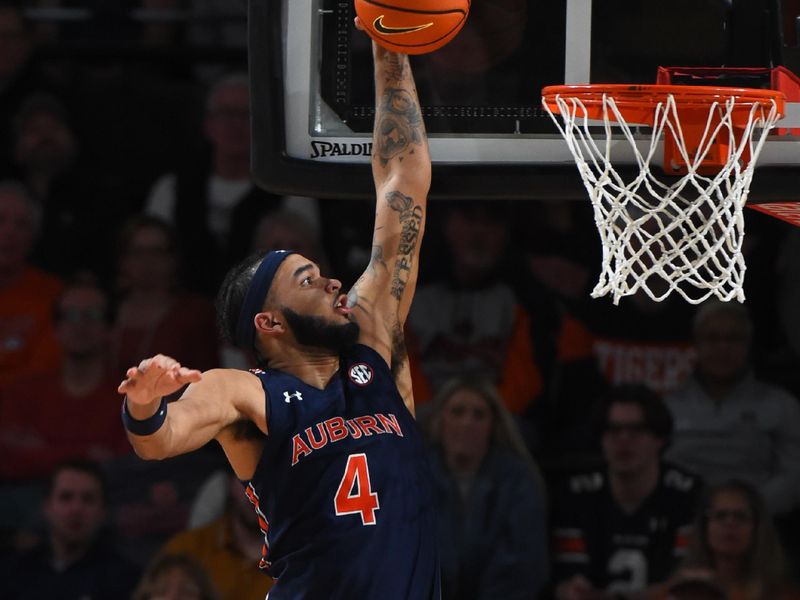 Feb 18, 2023; Nashville, Tennessee, USA; Auburn Tigers forward Johni Broome (4) dunks the ball during the second half against the Vanderbilt Commodores at Memorial Gymnasium. Mandatory Credit: Christopher Hanewinckel-USA TODAY Sports