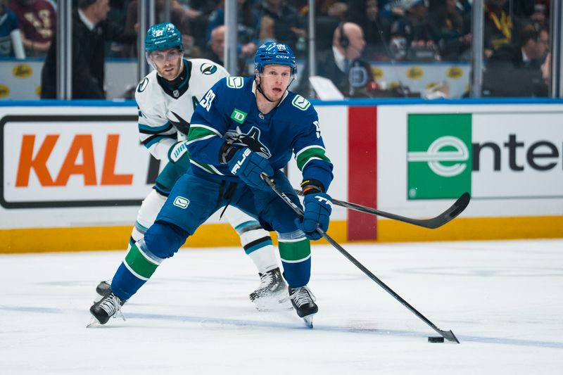 Dec 27, 2025; Vancouver, British Columbia, CAN; Vancouver Canucks forward Marco Rossi (93) handles the puck against the San Jose Sharks in the second period at Rogers Arena. Mandatory Credit: Bob Frid-Imagn Images