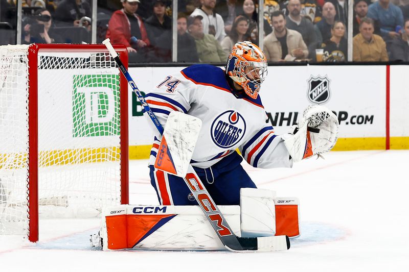 Mar 5, 2024; Boston, Massachusetts, USA; Edmonton Oilers goaltender Stuart Skinner (74) makes a glove save against the Boston Bruins during the second period at TD Garden. Mandatory Credit: Winslow Townson-USA TODAY Sports