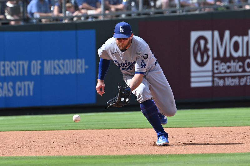 Jun 28, 2025; Kansas City, Missouri, USA;  Los Angeles Dodgers third baseman Max Muncy (13) fields a ground ball in the fifth inning against the Kansas City Royals at Kauffman Stadium. Mandatory Credit: Peter Aiken-Imagn Images