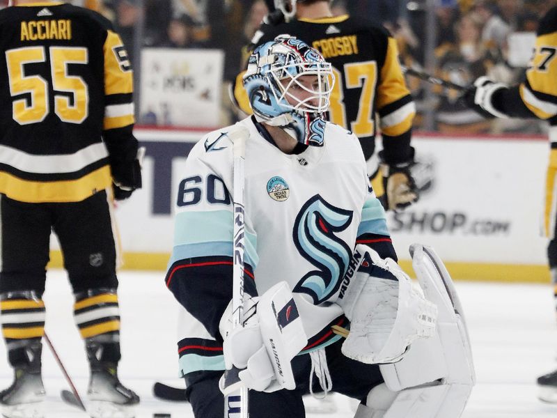 Jan 15, 2024; Pittsburgh, Pennsylvania, USA; Seattle Kraken goaltender Chris Driedger (60) warms up before the game against the Pittsburgh Penguins at PPG Paints Arena. Mandatory Credit: Charles LeClaire-USA TODAY Sports