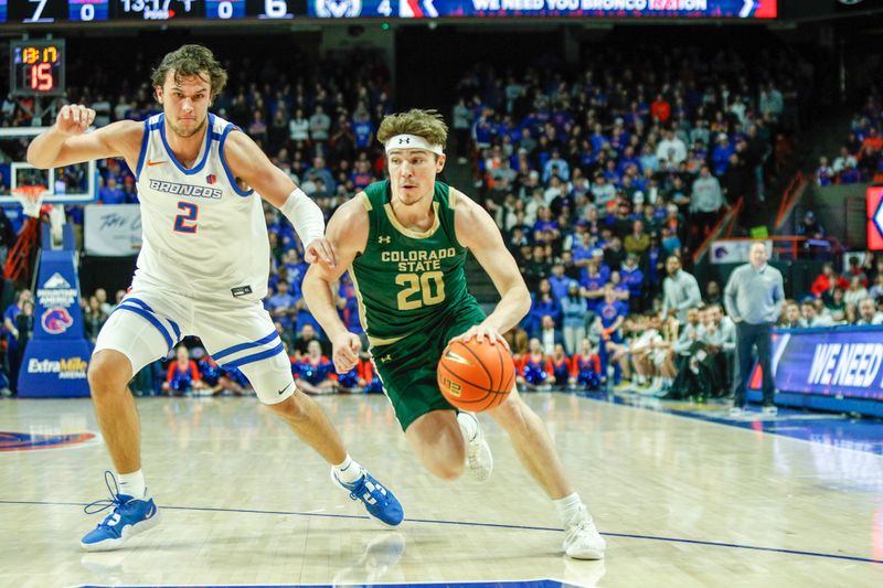 Jan 9, 2024; Boise, Idaho, USA; Colorado State Rams guard Joe Palmer (20) drives past Boise State Broncos forward Tyson Degenhart (2) during the first half at ExtraMile Arena. Mandatory Credit: Brian Losness-USA TODAY Sports
