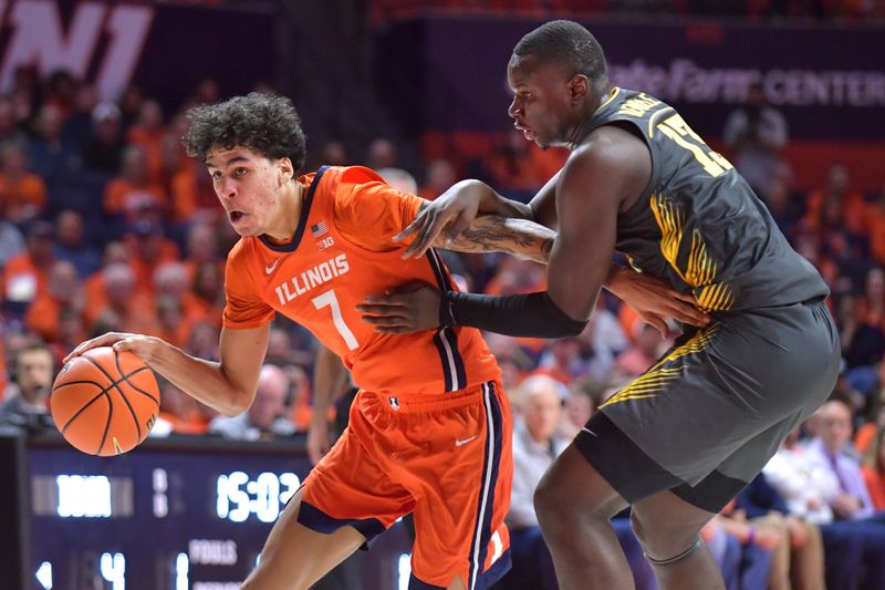 Feb 25, 2025; Champaign, Illinois, USA;  Illinois Fighting Illini forward Will Riley (7) drives the ball past Iowa Hawkeyes forward Ladji Dembele (13) during the
first half at State Farm Center. Mandatory Credit: Ron Johnson-Imagn Images