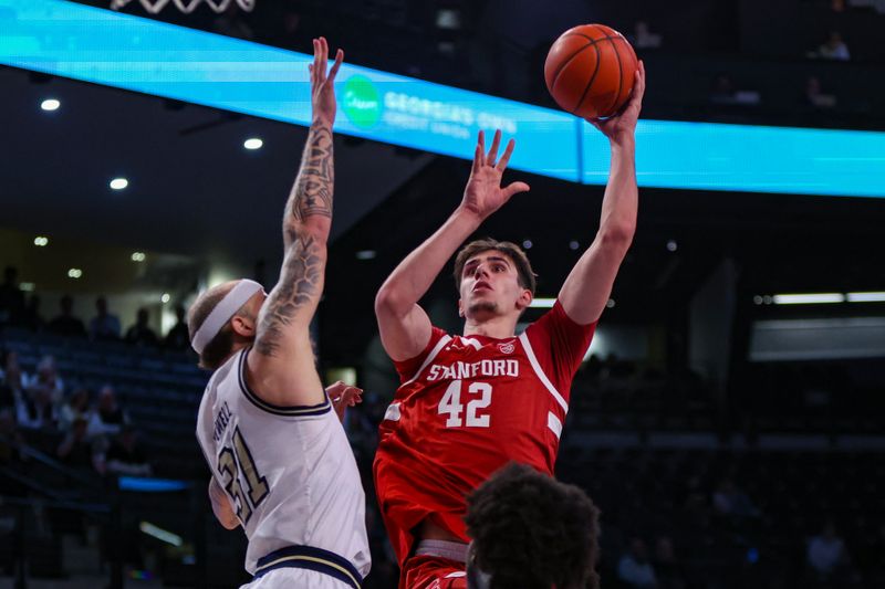 Feb 12, 2025; Atlanta, Georgia, USA; Stanford Cardinal forward Maxime Raynaud (42) shoots over Georgia Tech Yellow Jackets forward Duncan Powell (31) in the first half at McCamish Pavilion. Mandatory Credit: Brett Davis-Imagn Images
