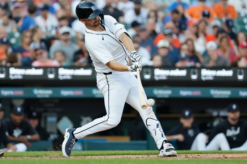 Aug 3, 2024; Detroit, Michigan, USA;  Detroit Tigers catcher Jake Rogers (34) hits the ball in the third inning against the Kansas City Royals at Comerica Park. Mandatory Credit: Rick Osentoski-USA TODAY Sports