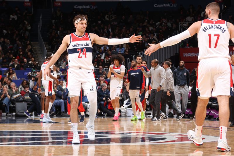 WASHINGTON, DC -?JANUARY 13:  Corey Kispert #24 and Jonas Valanciunas #17 of the Washington Wizards high five during the game against the Minnesota Timberwolves  on January 13, 2025 at Capital One Arena in Washington, DC. NOTE TO USER: User expressly acknowledges and agrees that, by downloading and or using this Photograph, user is consenting to the terms and conditions of the Getty Images License Agreement. Mandatory Copyright Notice: Copyright 2024 NBAE (Photo by Kenny Giarla/NBAE via Getty Images)