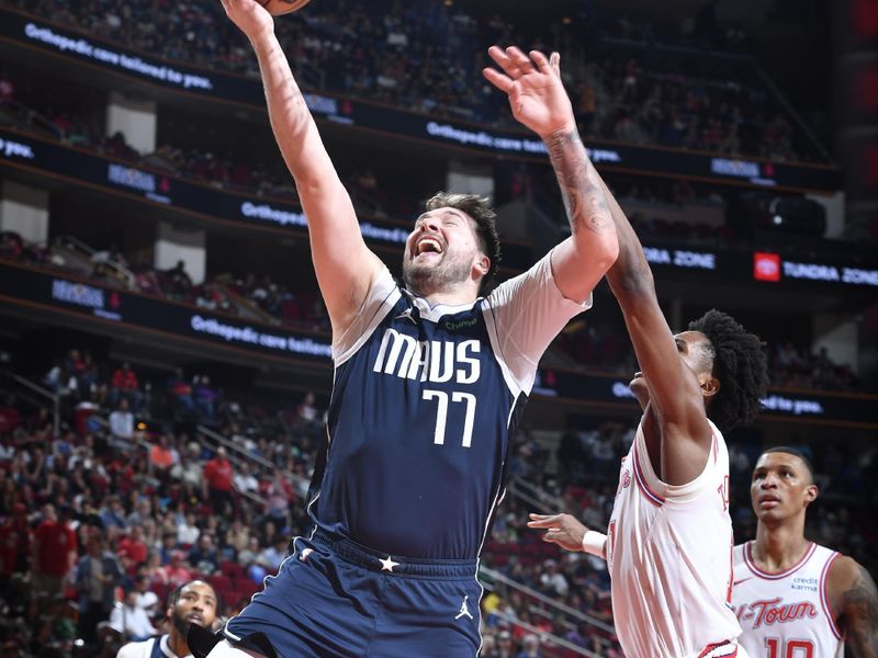 HOUSTON, TX - MARCH 31: Luka Doncic #77 of the Dallas Mavericks drives to the basket during the game against the Houston Rockets on March 31, 2024 at the Toyota Center in Houston, Texas. NOTE TO USER: User expressly acknowledges and agrees that, by downloading and or using this photograph, User is consenting to the terms and conditions of the Getty Images License Agreement. Mandatory Copyright Notice: Copyright 2024 NBAE (Photo by Logan Riely/NBAE via Getty Images)