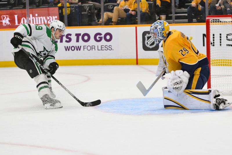Oct 26, 2025; Nashville, Tennessee, USA;  Nashville Predators goaltender Justus Annunen (29) blocks the shot of Dallas Stars center Justin Hryckowian (49) during the second period at Bridgestone Arena. Mandatory Credit: Steve Roberts-Imagn Images