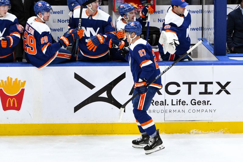 Dec 9, 2023; Elmont, New York, USA; New York Islanders left wing Anders Lee (27) celebrates with teammates after scoring a goal against the Los Angeles Kings during the third period at UBS Arena. Mandatory Credit: John Jones-USA TODAY Sports