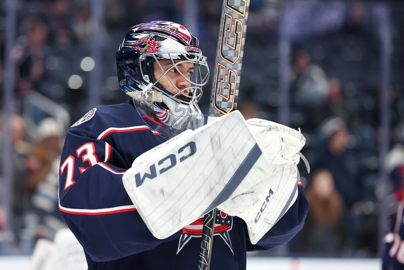 Jan 24, 2026; Columbus, Ohio, USA;  Columbus Blue Jackets goaltender Jet Greaves (73) warms up before a game against the before the game against the Tampa Bay Lightning at Nationwide Arena. Mandatory Credit: Joseph Maiorana-Imagn Images