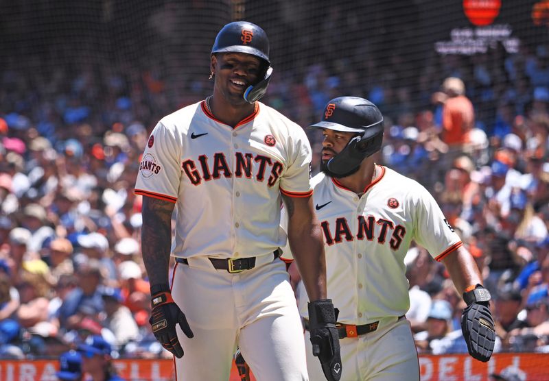 Jun 30, 2024; San Francisco, California, USA; San Francisco Giants designated hitter Jorge Soler (2) and center fielder Heliot Ramos (17) after being batted in against the Los Angeles Dodgers during the fourth inning at Oracle Park. Mandatory Credit: Kelley L Cox-USA TODAY Sports