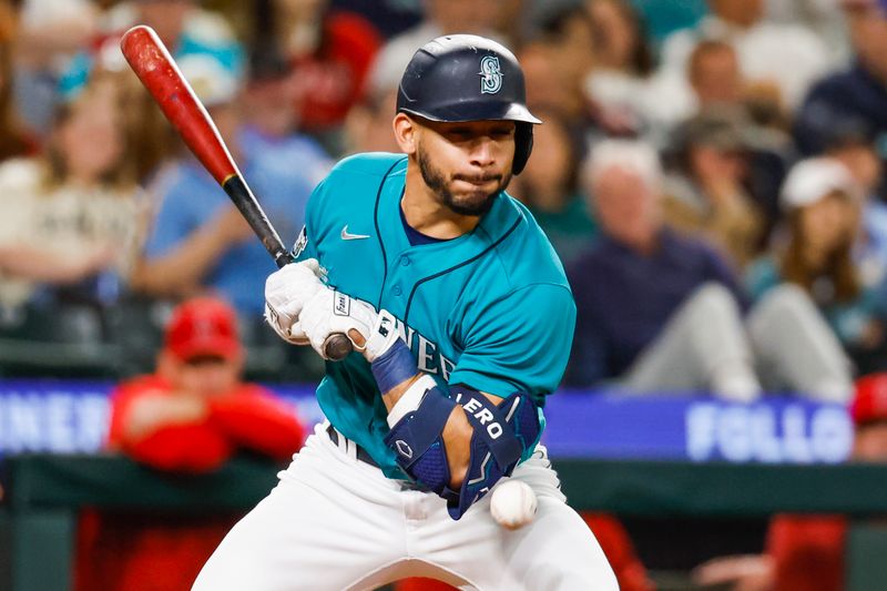 Sep 12, 2023; Seattle, Washington, USA; Seattle Mariners second baseman Jose Caballero (76) gets hit by a pitch against the Los Angeles Angels during the eighth inning at T-Mobile Park. Mandatory Credit: Joe Nicholson-USA TODAY Sports