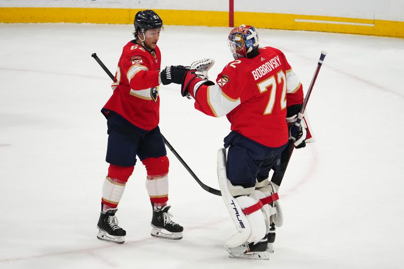 Dec 29, 2023; Sunrise, Florida, USA; Florida Panthers defenseman Brandon Montour (62) celebrates with Florida Panthers goaltender Sergei Bobrovsky (72) after defeating the New York Rangers at Amerant Bank Arena. Mandatory Credit: Jasen Vinlove-USA TODAY Sports