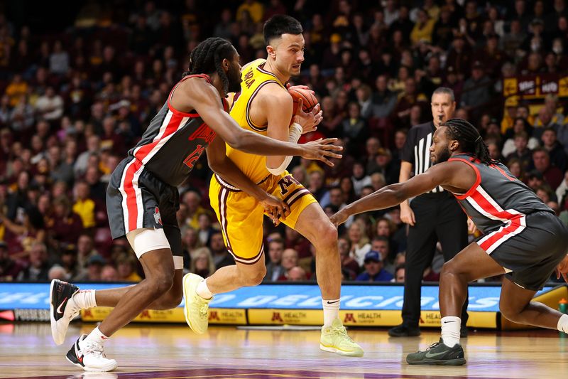 Feb 22, 2024; Minneapolis, Minnesota, USA; Minnesota Golden Gophers forward Dawson Garcia (3) works towards the basket as Ohio State Buckeyes guard Evan Mahaffey (12) defends during the first half at Williams Arena. Mandatory Credit: Matt Krohn-USA TODAY Sports