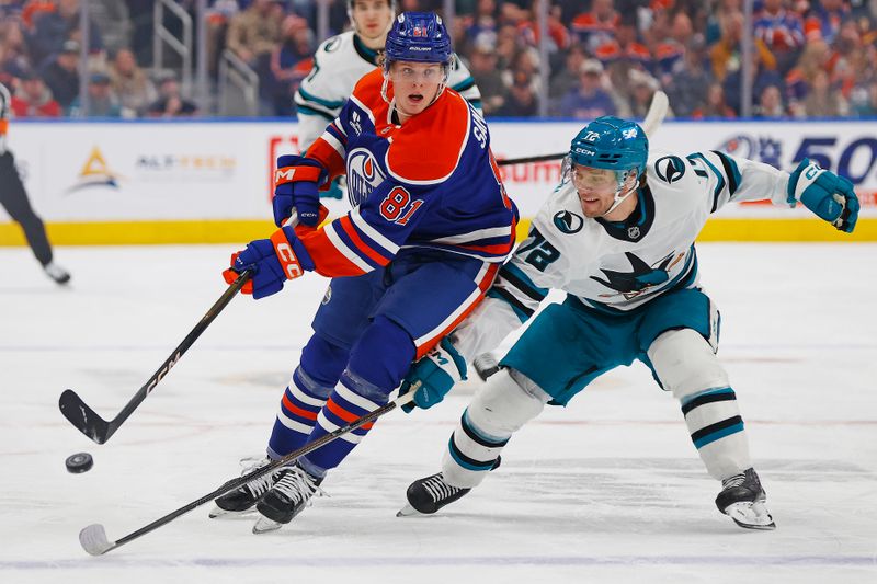 Jan 29, 2026; Edmonton, Alberta, CAN; Edmonton Oilers forward Josh Samanski (81) chips the puck past .San Jose Sharks forward William Eklund (72) during the first period  at Rogers Place. Mandatory Credit: Perry Nelson-Imagn Images