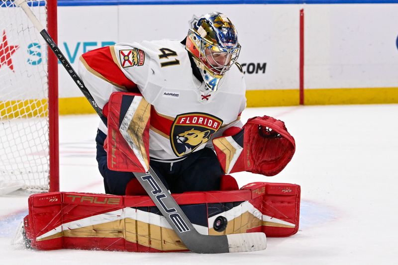 Jan 27, 2024; Elmont, New York, USA; Florida Panthers goaltender Anthony Stolarz (41) makes a save against the New York Islanders during overtime at UBS Arena. Mandatory Credit: Dennis Schneidler-USA TODAY Sports