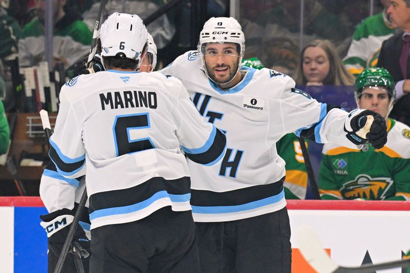 Oct 25, 2025; Saint Paul, Minnesota, USA;  Utah Mammoth forward Nick Schmaltz (8) celebrates his goal against the Minnesota Wild with defensemen John Marino (6) during the first period at Grand Casino Arena. Mandatory Credit: Nick Wosika-Imagn Images